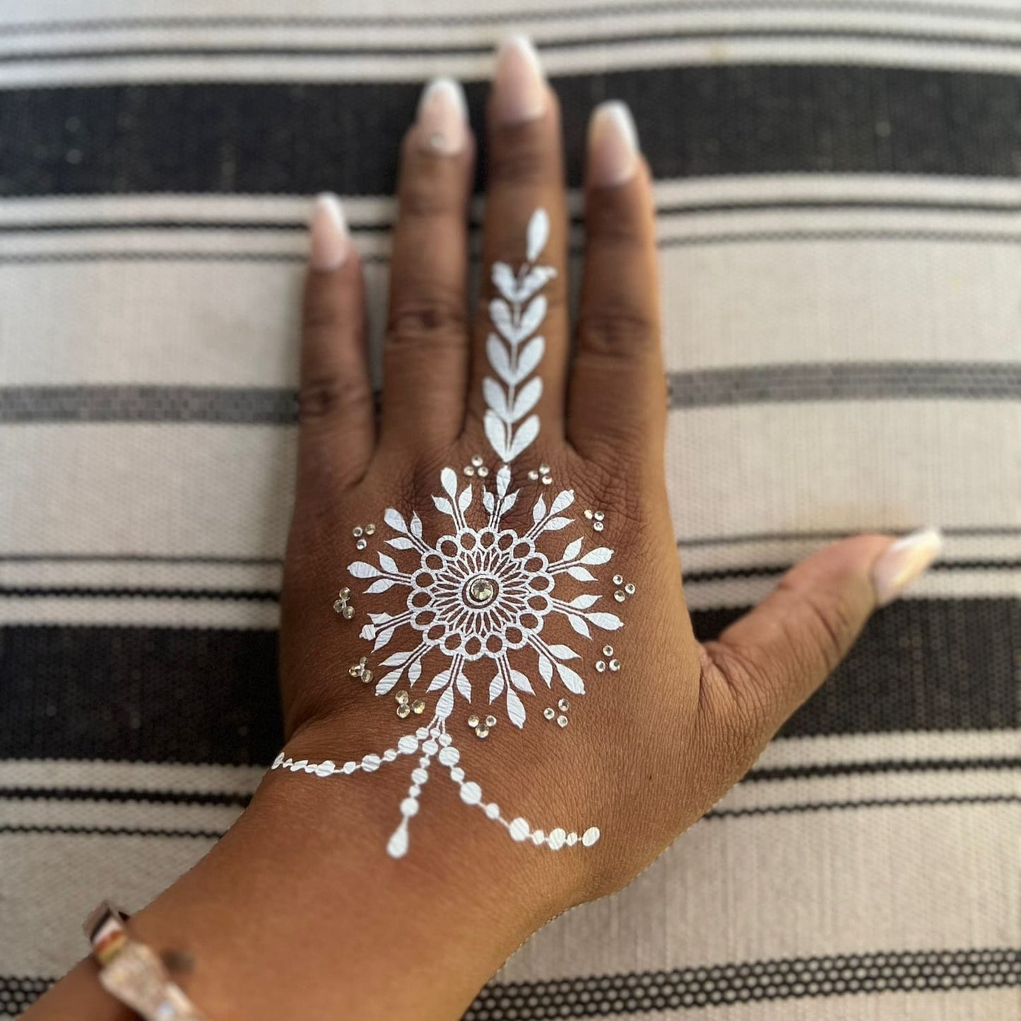 Snow pearl henna body art on skin — premium press & peel application | Palace.design